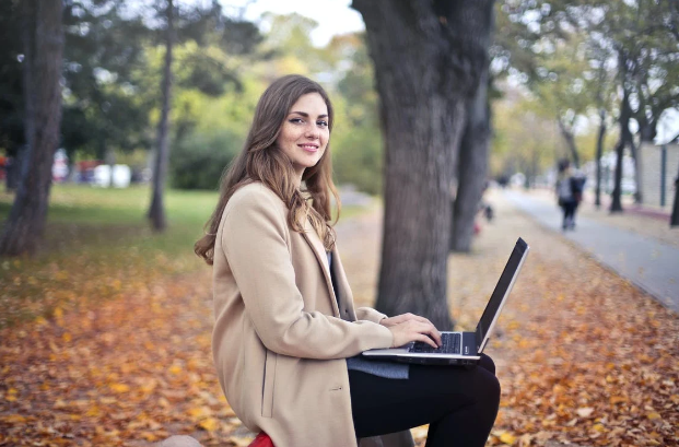 Lady on laptop in park