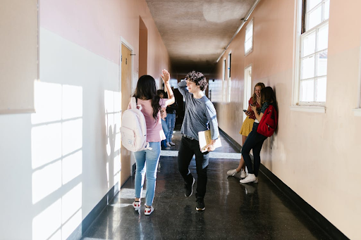 teens in high school corridor