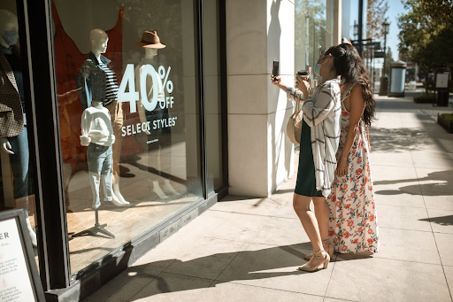 ladies looking in shop window