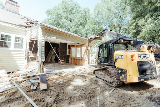 jcb next to house