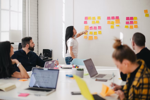 meeting and lady with post it notes