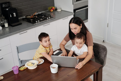 mum and two young children at table