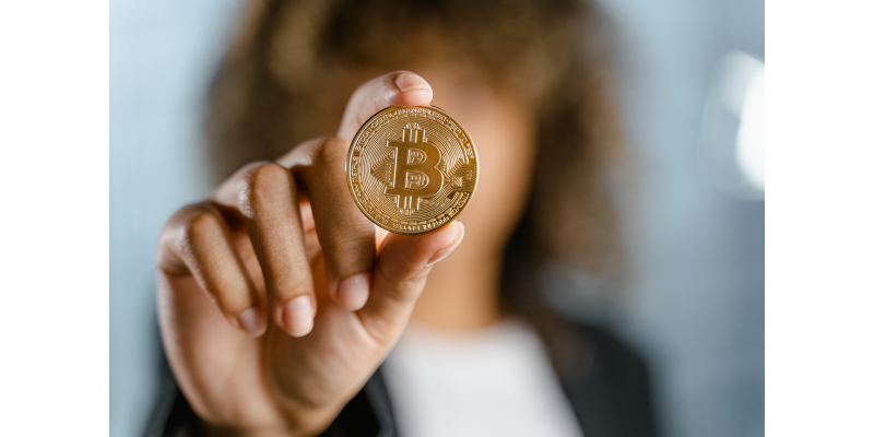 Woman holding bitcoin