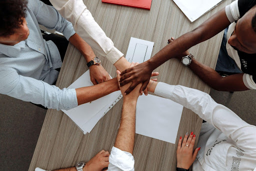 hands touching over table