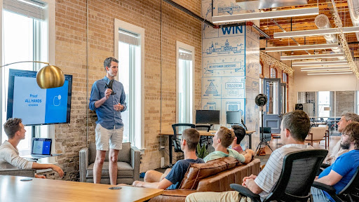 man doing presentation to group of men