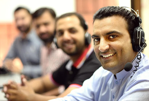men with headphones smiling