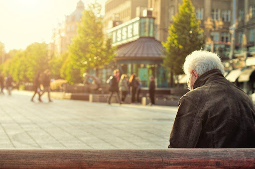 older man sitting on bench