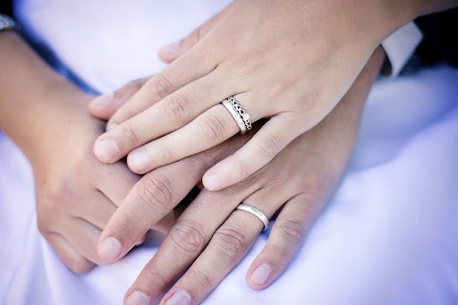 hands with wedding rings