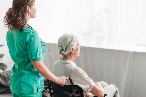 nurse with patient in wheelchair