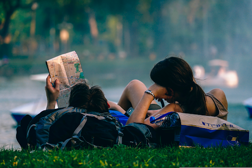Couple on grass looking at map