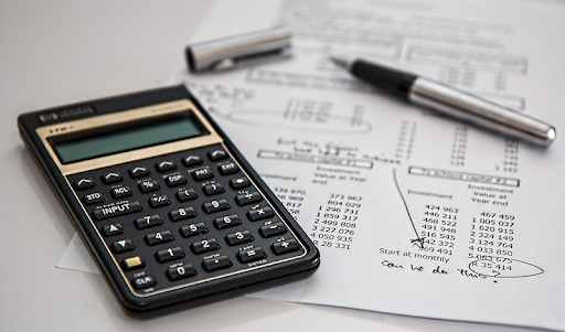 calculator and page of figures
