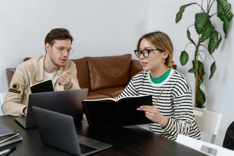 man and woman discussing work