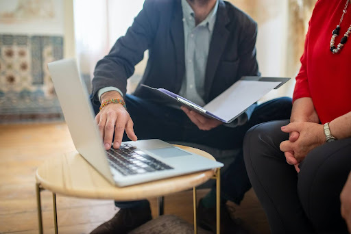 man showing documents to lady