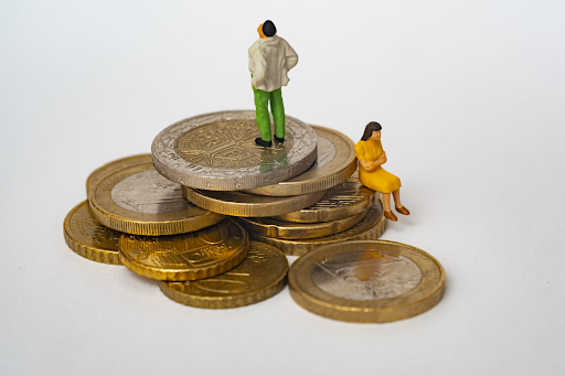 male and female figure with coins